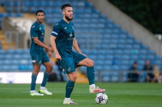 Matt Grimes of Swansea City controls the ball during a pre-season friendly match between Oxford United and Swansea City at the Kassam Stadium on July 21, 2023 in Oxford, England.