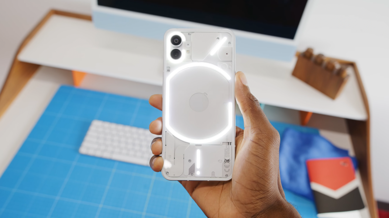 Nothing Phone in-hand with all LED lights turned on