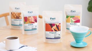 Lifestyle image of bags of Pact Coffee beans