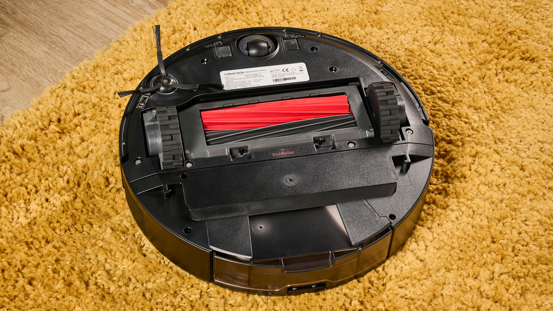 Roborock Q5 Pro+ robot vacuum flipped over to show underside