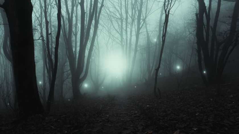 Small ghostly lights appear along a dirt track.