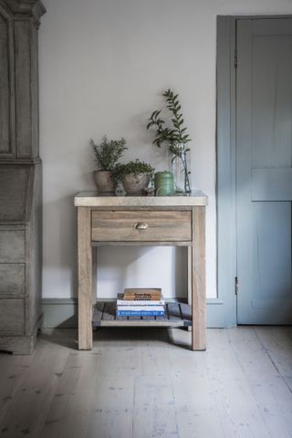 A small wooden butchers block used as a storage