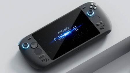 Ayaneo Next 2 handheld on grey block platform with logo on screen.