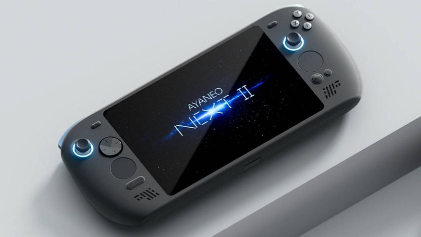 Ayaneo Next 2 handheld on grey block platform with logo on screen.
