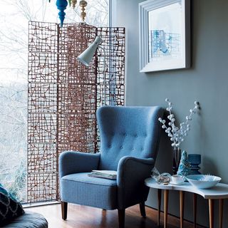 blue wall with blue chair and wall frame