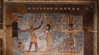 Restored ceiling in ancient Egyptian temple. Image displays iconography of the gods Orion, Sothis/Sirius and Anukis, above them the sky goddess Nut swallows the evening sun.