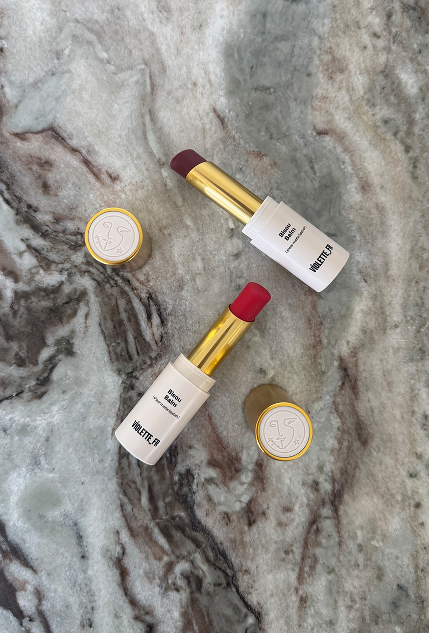 Bisou balm lip balms on a marble table