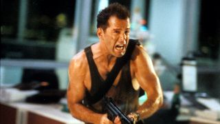 Bruce Willis charging with gun in Die Hard