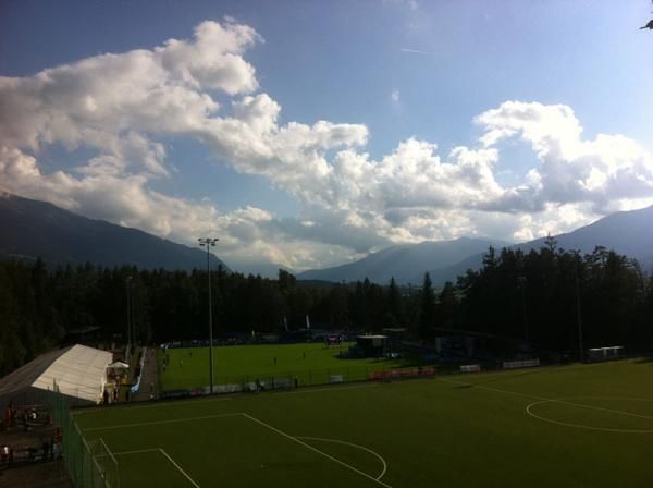 A view over a soccer field to the start/finish stadium area.