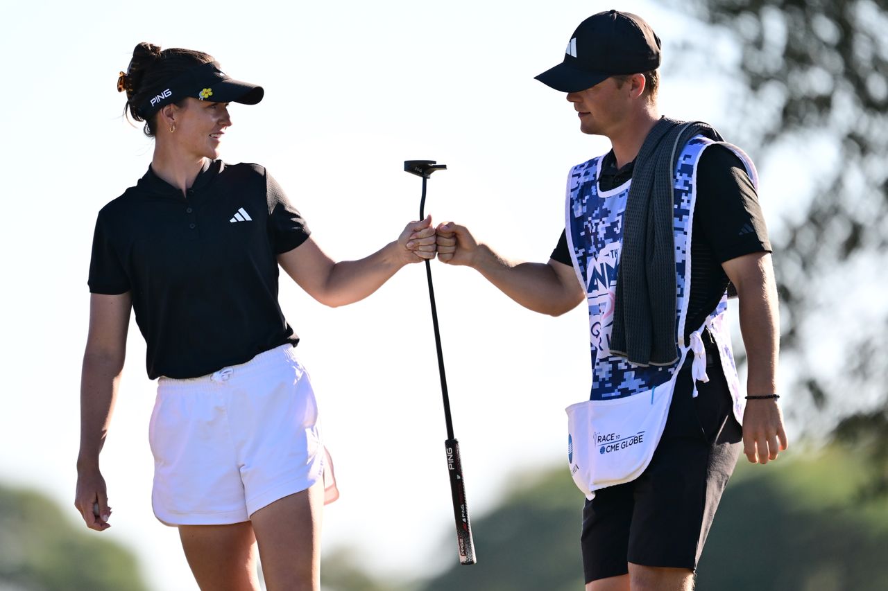 Linn Grant fist pumps her caddie