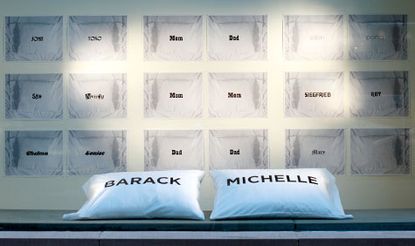 White pillows with black printed names on