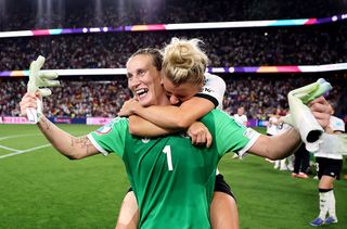 Ann-Katrin Berger of Germany celebrates victory with teammate Linda Dallmann after Germany defeat France 6-5 in the penalty shootout during the UEFA Women's EURO 2025 Quarter-Final match between France and Germany at St. Jakob-Park on July 19, 2025 in Basel, Switzerland.