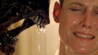 Scene from the movie Alien 3. An Alien is snarling in Ellen Ripley's face. Ripley is scared.