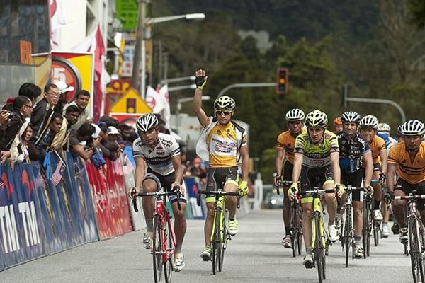 Italian sprinter Andrea Guardini waves to the locals and also goodbye to the yellow jersey as the tour heads into the mountains.