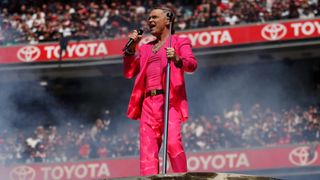 Robbie Williams performs during the 2022 Toyota AFL Grand Final match between the Geelong Cats and the Sydney Swans at the Melbourne Cricket Ground on September 24, 2022 in Melbourne, Australia.