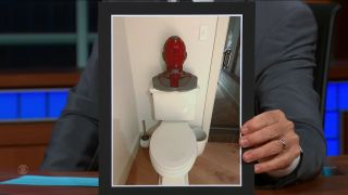 Vision sitting a toilet tank in Paul Bettany's house on The Late Show with Stephen Colbert