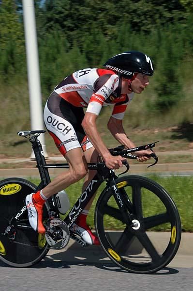 Chris Baldwin (OUCH p/b Maxxis) powers over a small hill.