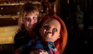 Curse of Chucky Alice holds the new Chucky doll in her arms
