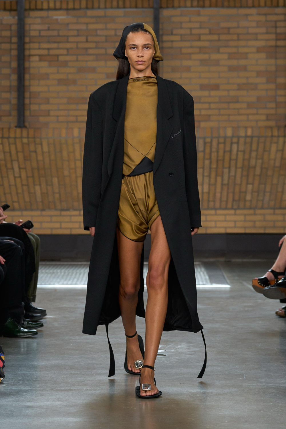 Calvin Klein NYFW ss26 catwalk - black coat, sandals, olive green silk shorts set