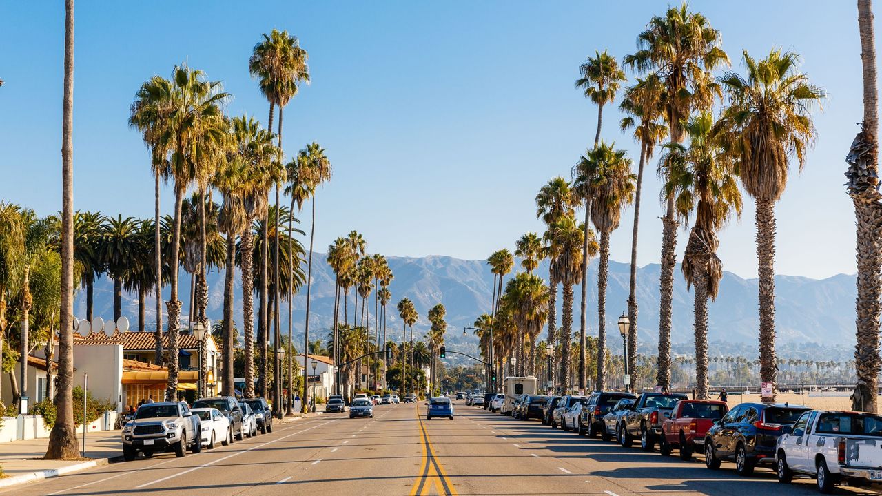 A California street with mountains in the background framed by palm trees for IRS balance due story