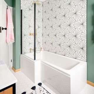 green bathroom with black and white tiles