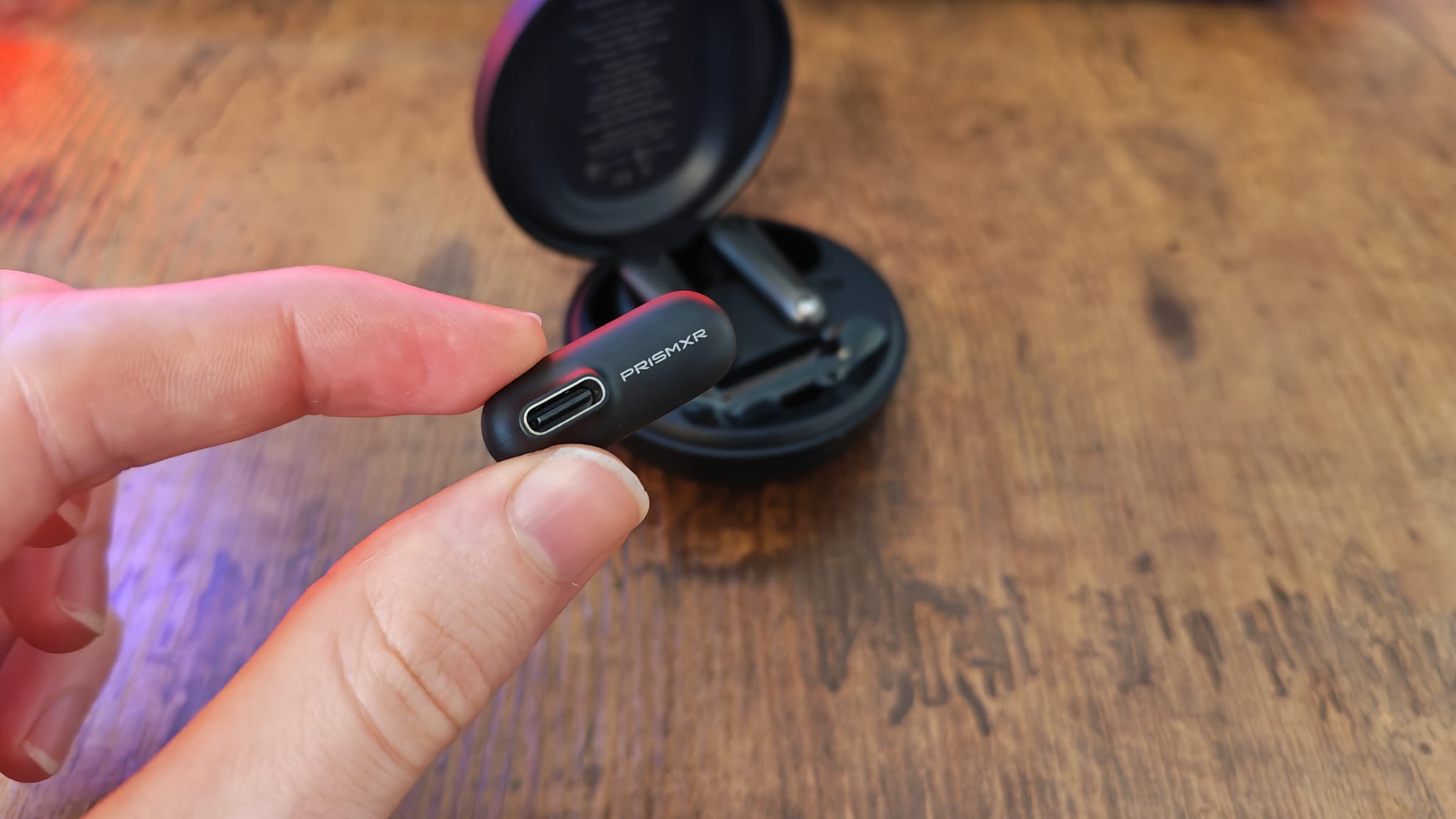 The passthrough USB-C port on the PrismXR Vega T1 earbuds wireless dongle