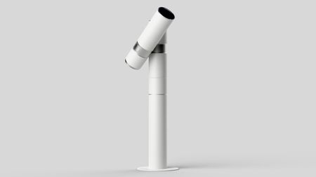 A sleek, modern white telescope mounted on a cylindrical base, angled slightly upward against a neutral background