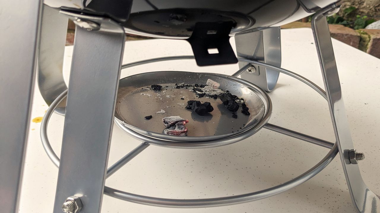 Napoleon NK14 Portable Charcoal Kettle Grill being tested in writer's home