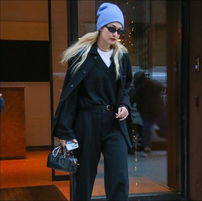 Gigi Hadid in a blue beanie and black outfit