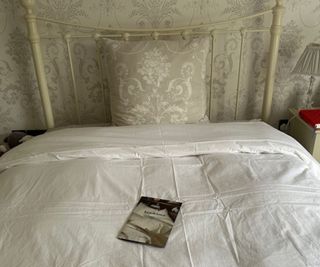 Brooklinen Down Comforter on a bed.