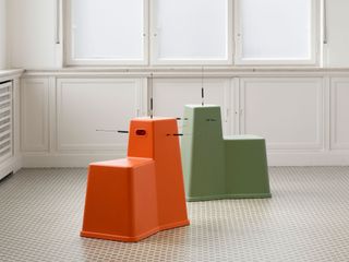 Orange and green stool tool