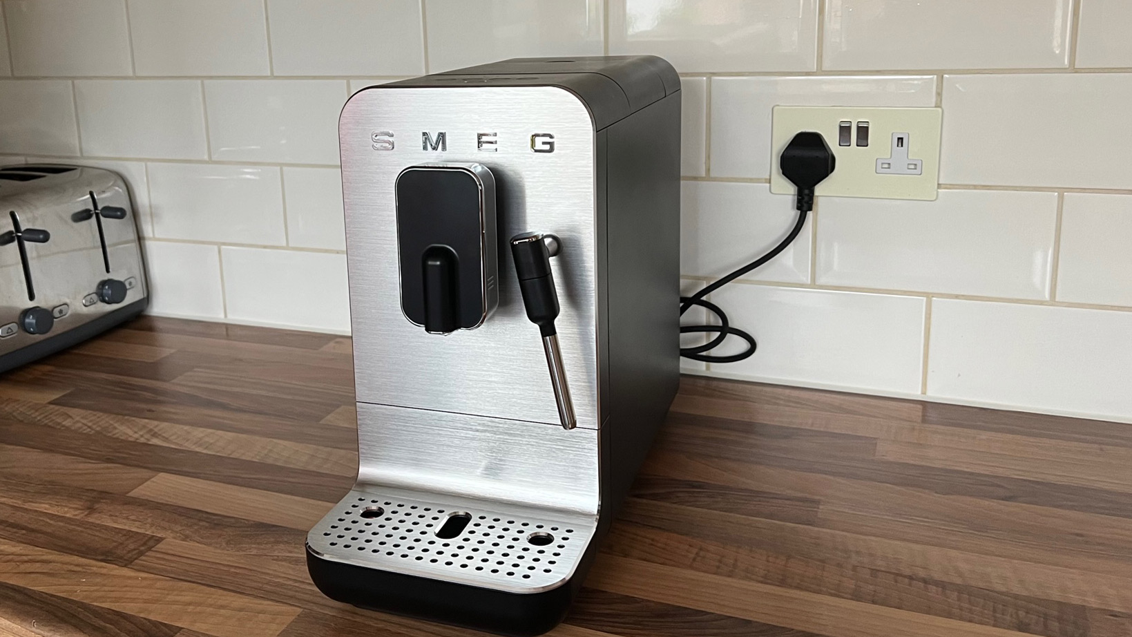 The Smeg Bean to Cup BCC02 coffee machine on a kitchen countertop