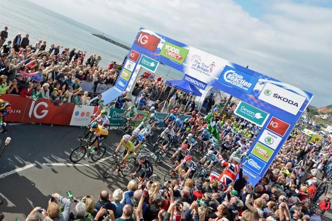 Tour of Britain leader Bradley Wiggins (Sky) leads the bunch out of Sidmouth in front of huge crowds