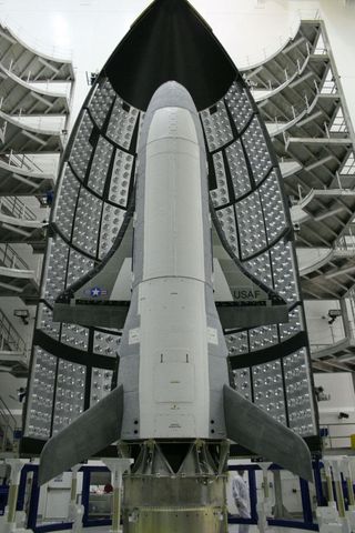 The U.S. Air Force's X-37B space plane waits in the encapsulation cell of the Evolved Expendable Launch Vehicle on April 5, 2010, at the Astrotech facility in Titusville, Florida. The vehicle launched on the first X-37B mission on April 22, 2010.