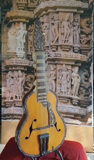 The gandharvi is a 12-/14- string guitar/veena/santoor/sarangi created by Debashish Bhattacharya.