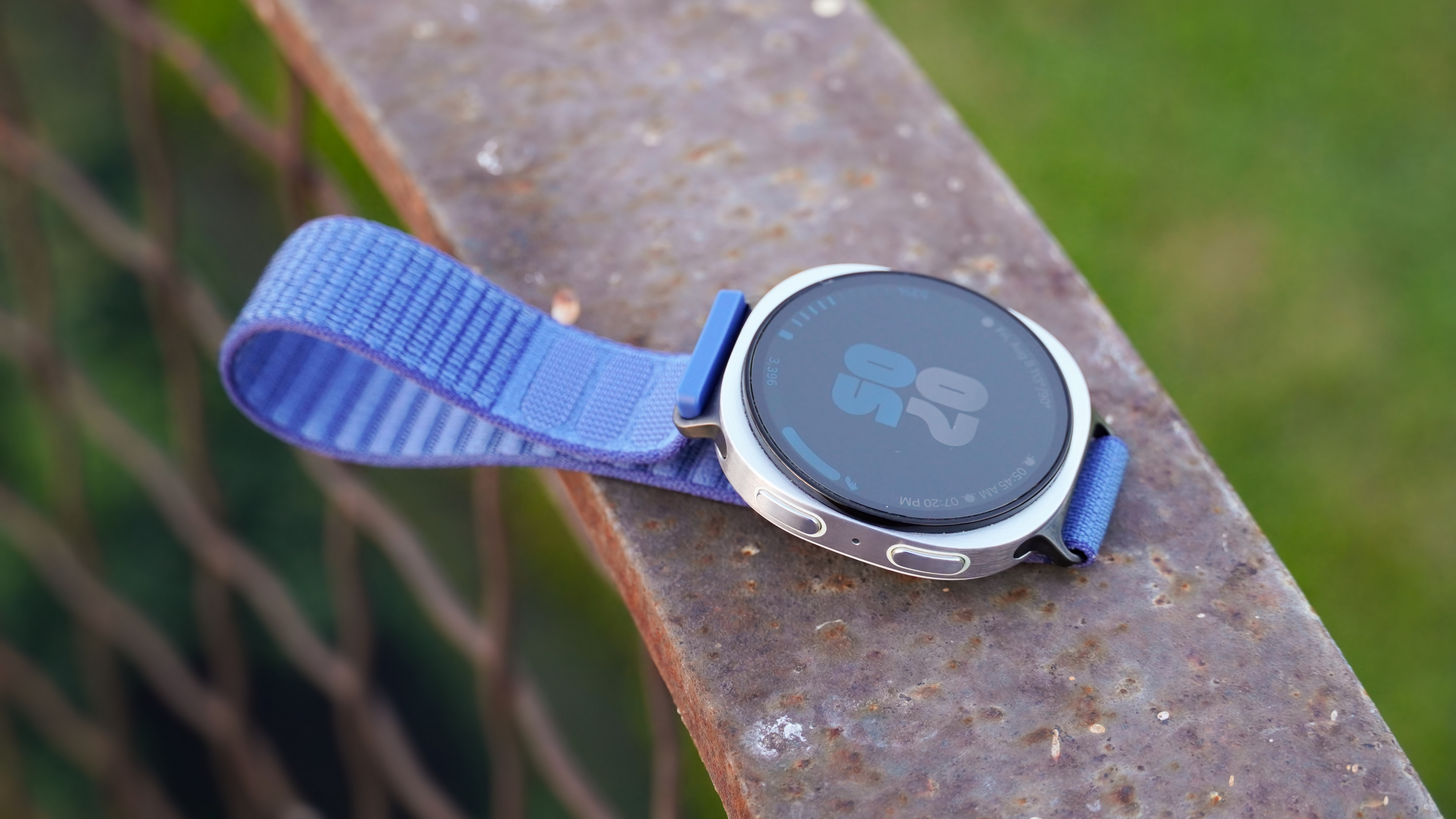 The Samsung Galaxy Watch 8 on a railing.