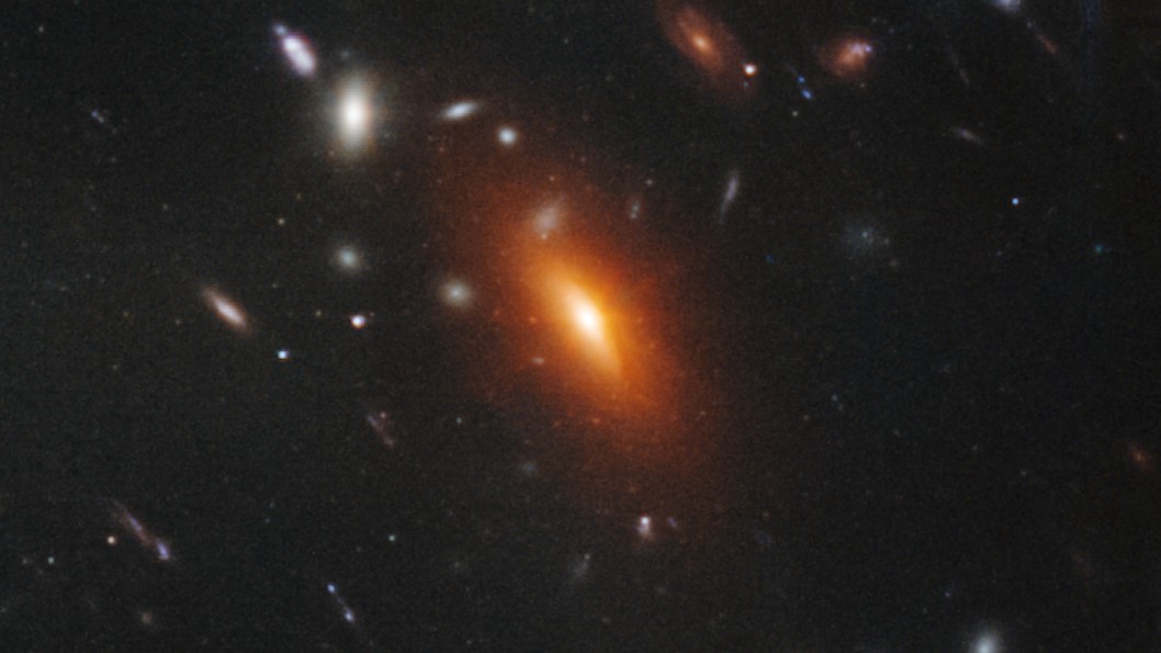 Orange elliptical galaxies like this are mostly made up of old, dead stars.