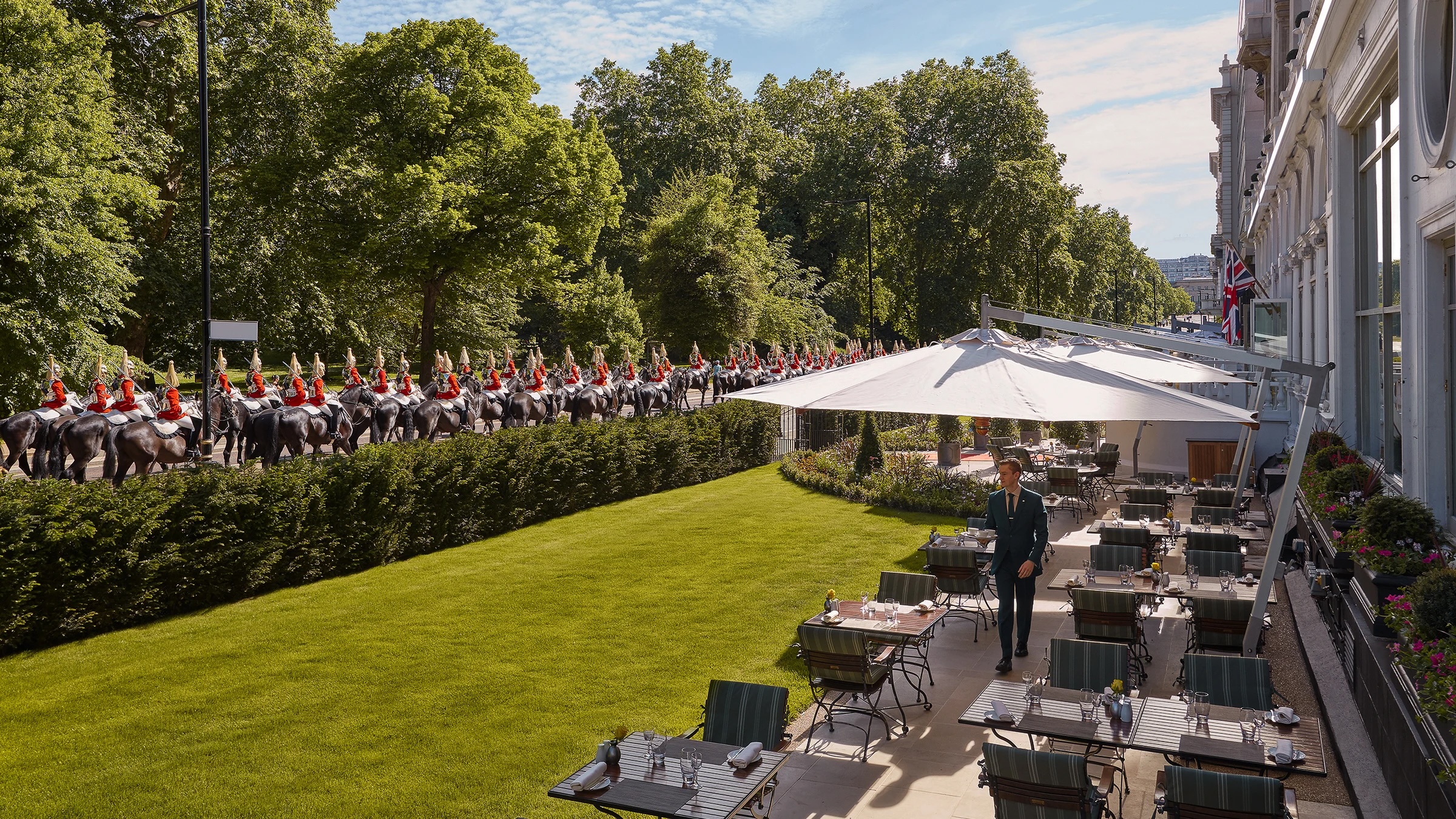 The Household Cavalry parade past the Mandarin Oriental hotel and terrace