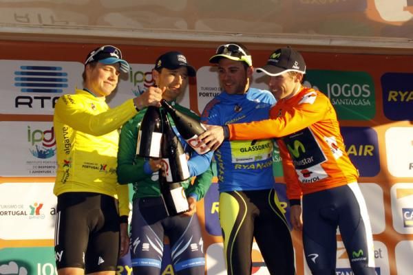 The jersey holders share a toast on the podium in Lagoa.