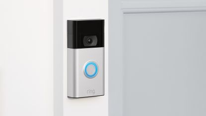 Ring Video Doorbell 2nd Gen mounted on wall next to door