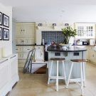 kitchen dinner room with limestone flooring and wooden stool