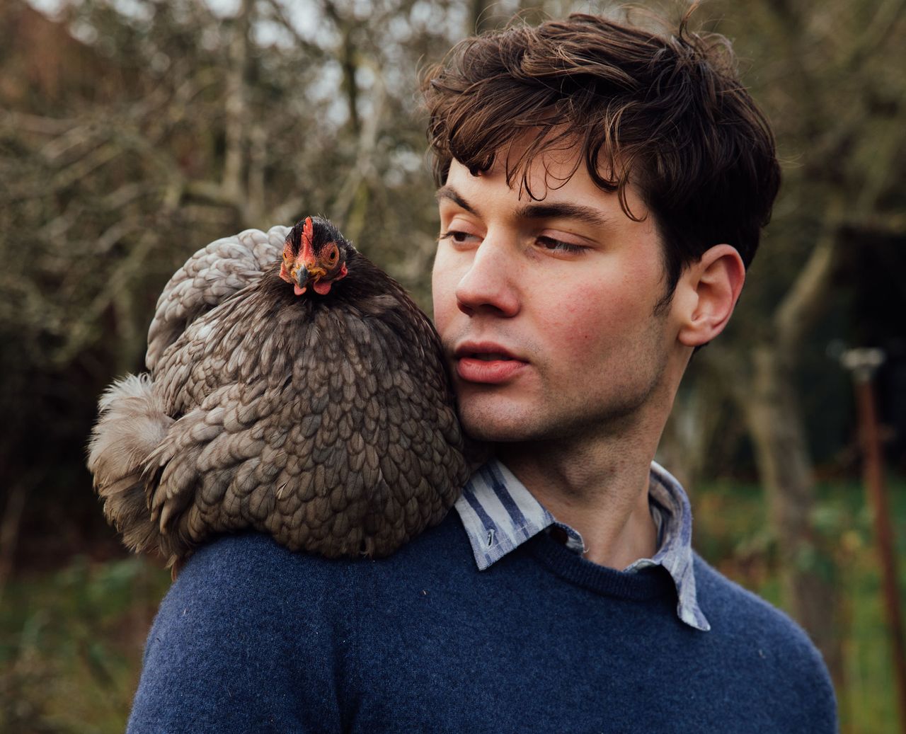 Arthur Parkinson with one of his beloved chickens. ©Daniel Gould / Country Life