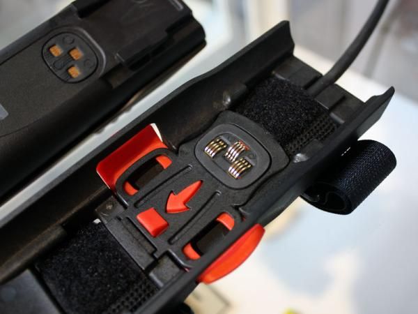The battery contact area is surrounded by rubber seals to prevent water contamination.