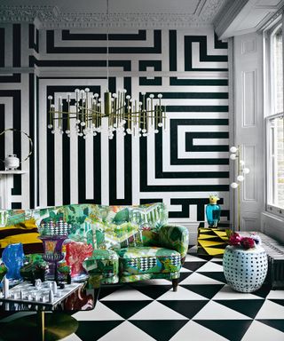 Graphic white and black monochrome wallpaper and flooring in modern living room