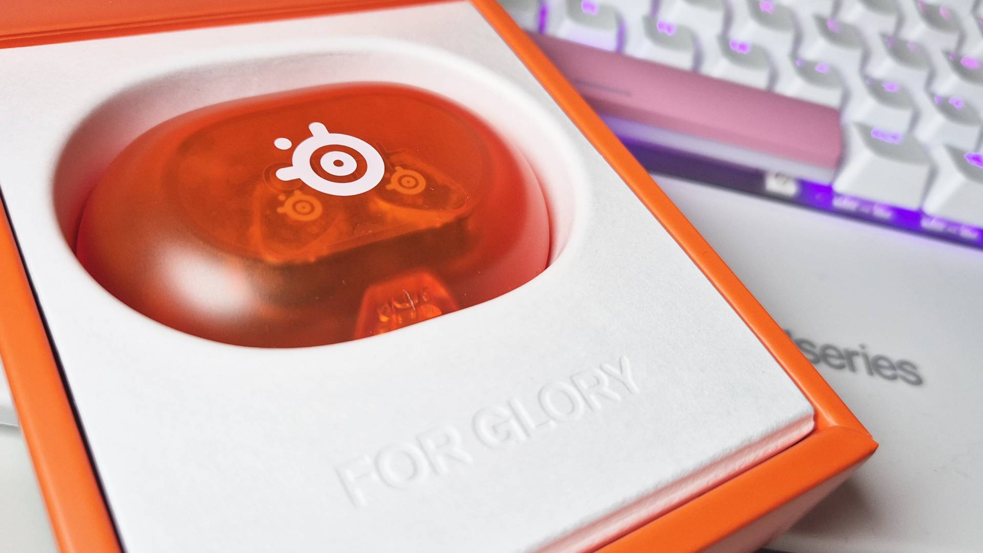 Photo of the limited edition SteelSeries 'Glorange' GameBuds, taken by writer Rosalie Newcombe.