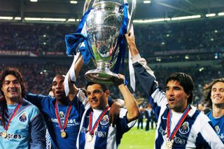 Deco (right) holds up the European Cup after Porto's victory over Monaco in 2005.