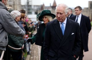 King Charles III and Queen Camilla greet people after attending the Easter Mattins Service at Windsor Castle on March 31, 2024 in Windsor, England.