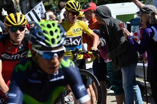 Nairo Quintana passes a running Chris Froome during stage 12 at the Tour de France.