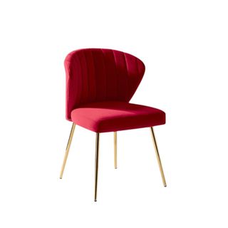 A plush red accent chair with gold legs