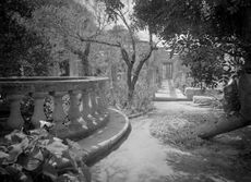 View of the terrace and pergola at Villa Frere. ©Country Life Picture Library